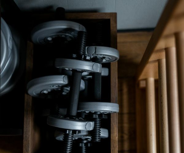 Professional sports equipment arranged neatly on a dark wooden floor.